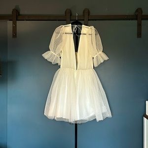 Short, white polka dotted tulle dress